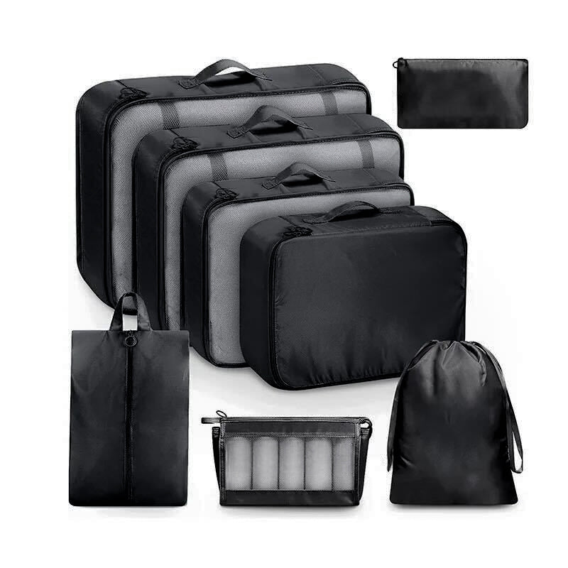 8 set of black packing cubes filled with contents.